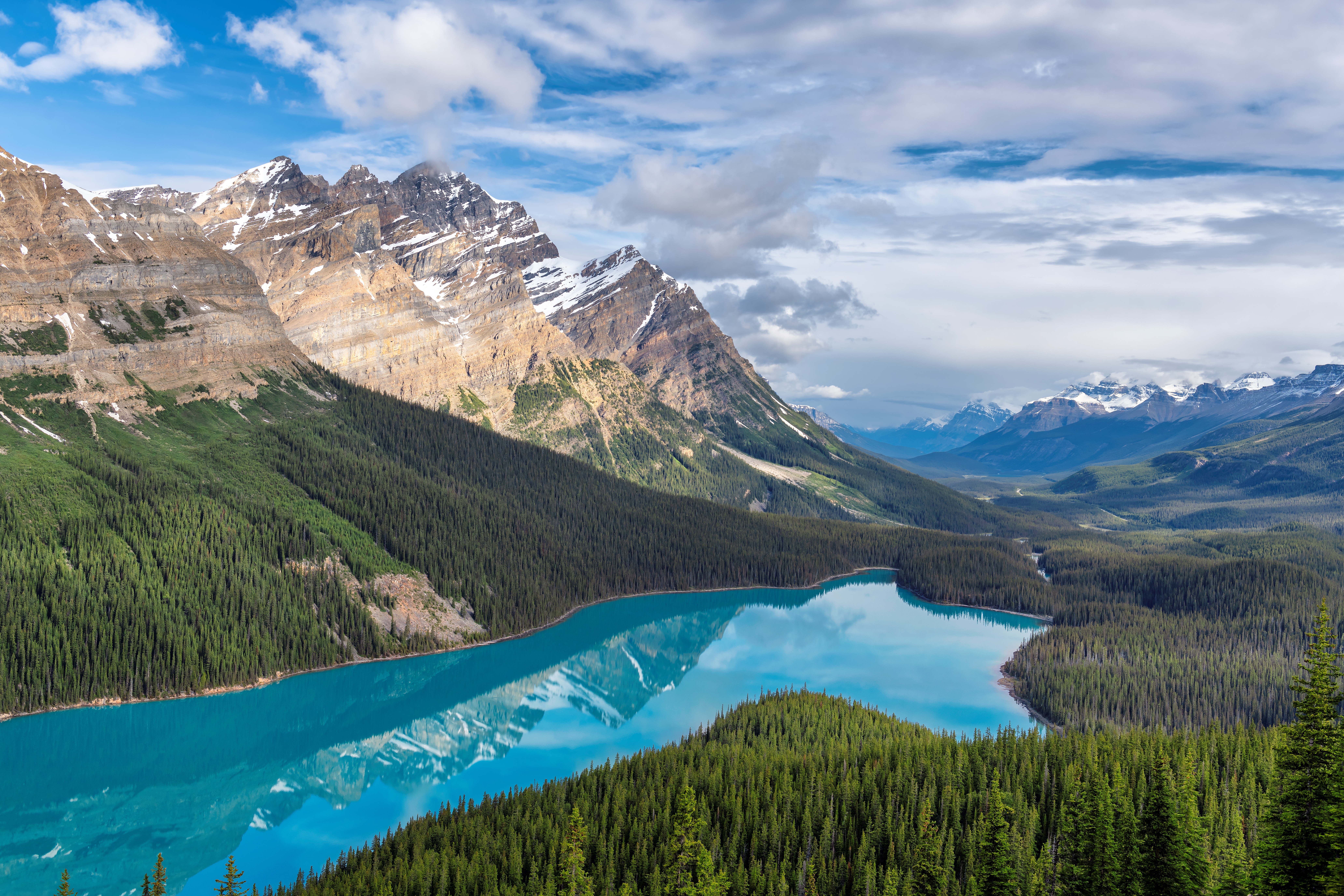 An aerial shot of Peyto Lake in Banff National Park. This lake is known for being shaped like a wolf or a fox face profile.